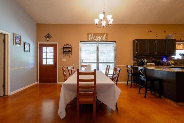 dining space featuring a chandelier