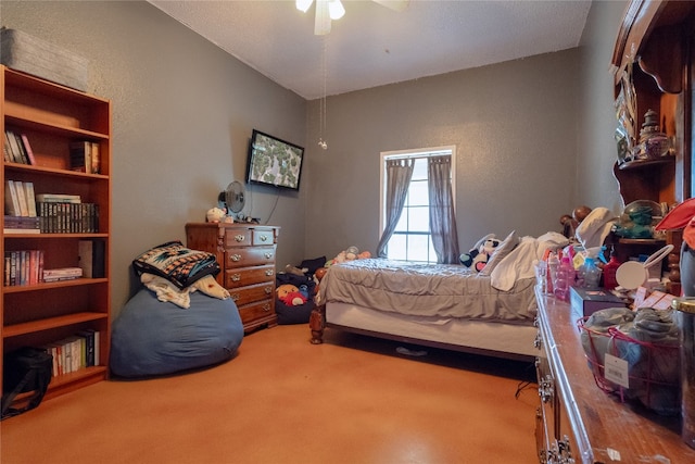 bedroom with ceiling fan and carpet floors