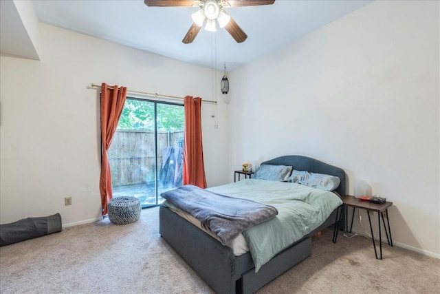 bedroom with access to exterior, light colored carpet, and ceiling fan