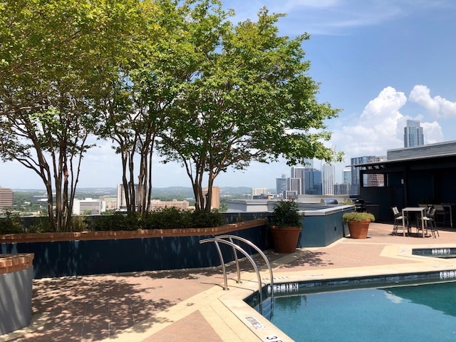 view of swimming pool featuring a patio