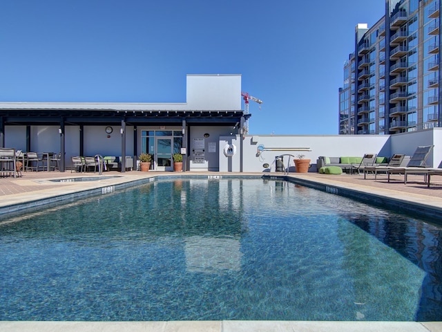 view of swimming pool featuring a patio area