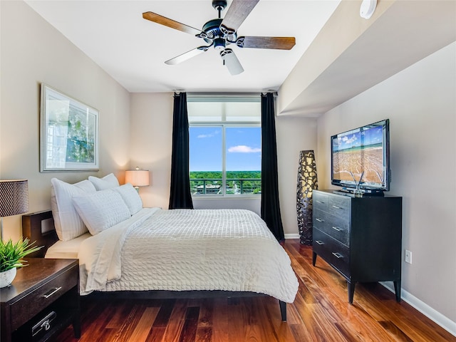 bedroom with ceiling fan and wood-type flooring