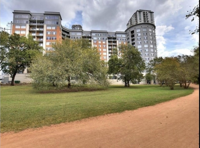 view of home's community featuring a lawn