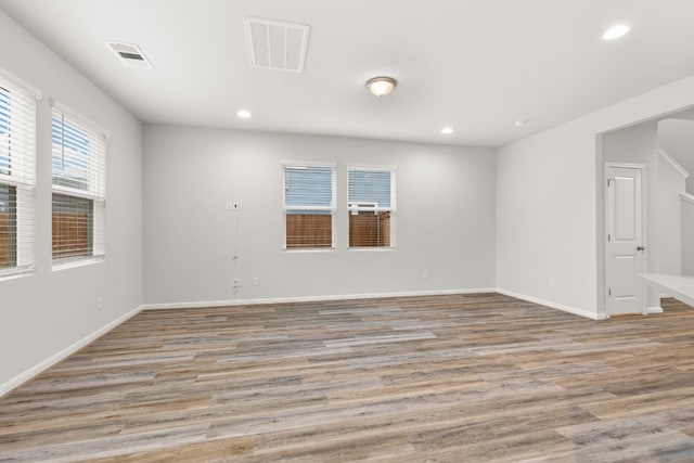 spare room with light hardwood / wood-style flooring