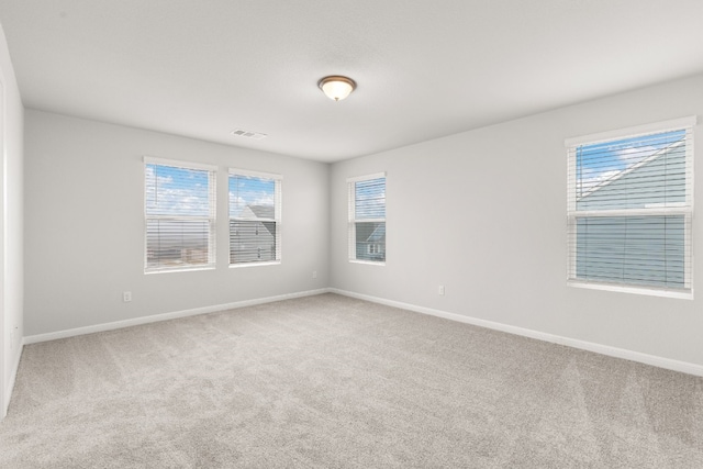 spare room featuring carpet flooring