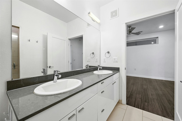 bathroom featuring ceiling fan, vanity, and tile patterned floors