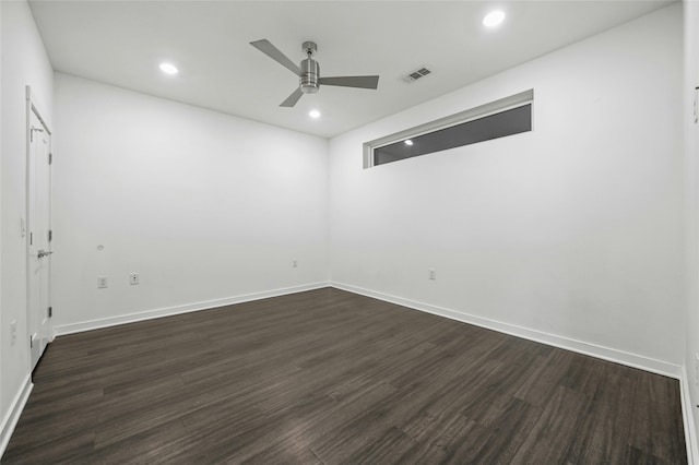 unfurnished room featuring ceiling fan and dark hardwood / wood-style flooring