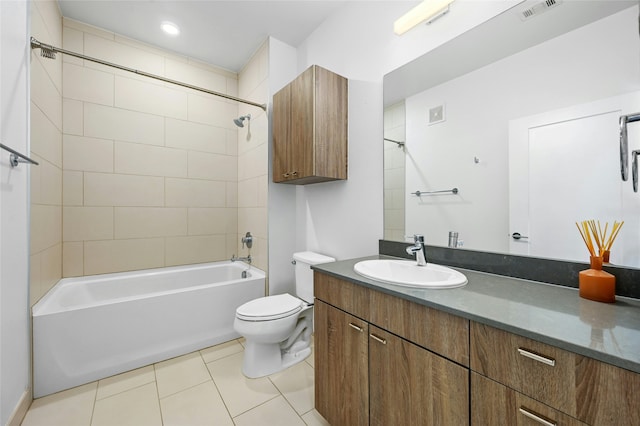 full bathroom with toilet, vanity, tile patterned flooring, and tiled shower / bath combo