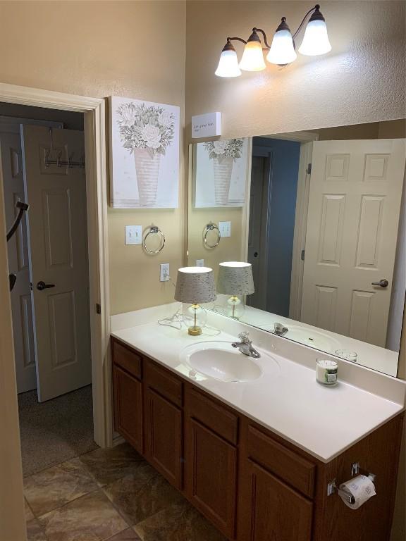 bathroom with vanity and tile patterned flooring