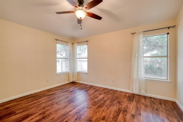 unfurnished room featuring dark hardwood / wood-style floors and ceiling fan