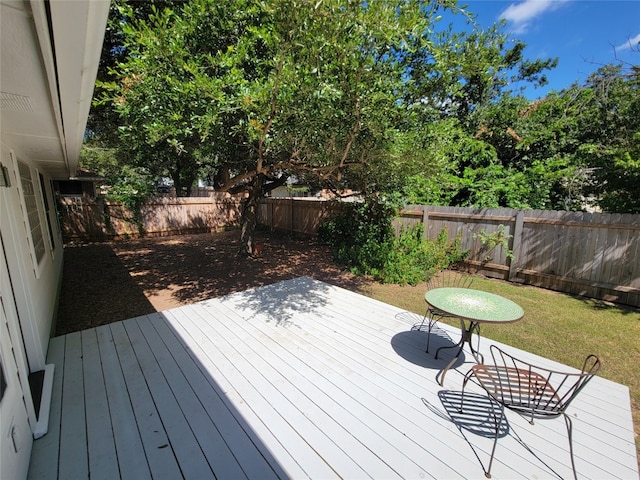 deck featuring a lawn