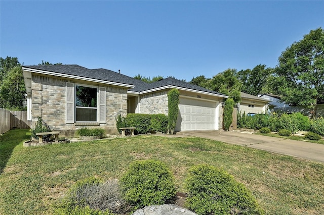 view of front of property with a garage and a front yard