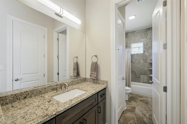 full bathroom with shower / tub combo, vanity, and toilet