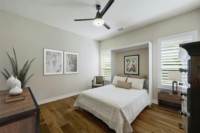 bedroom featuring ceiling fan and dark hardwood / wood-style flooring