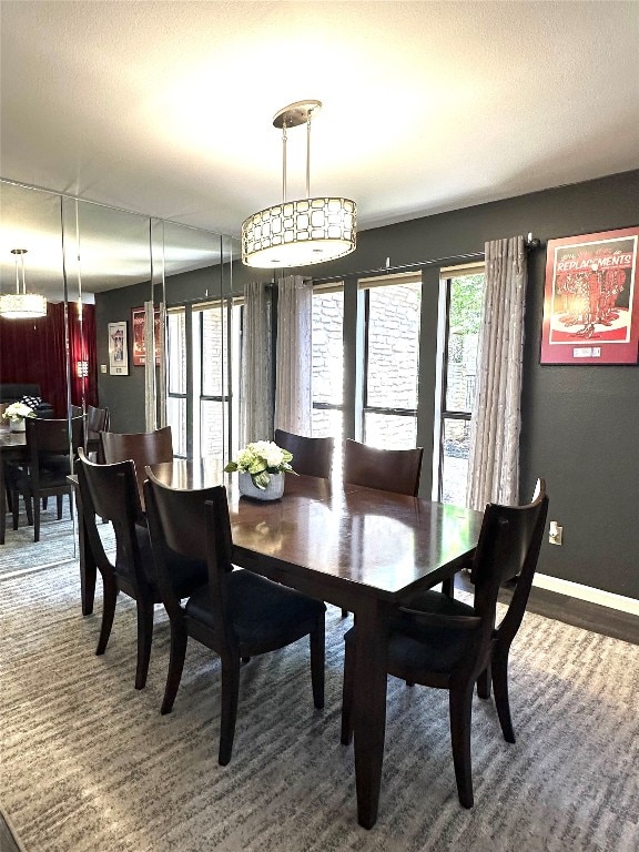 dining area with a textured ceiling