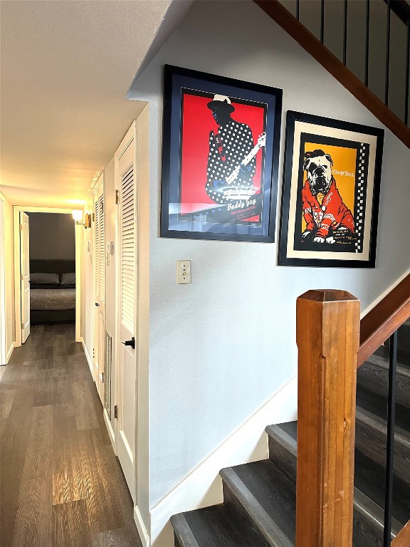 hallway with hardwood / wood-style flooring