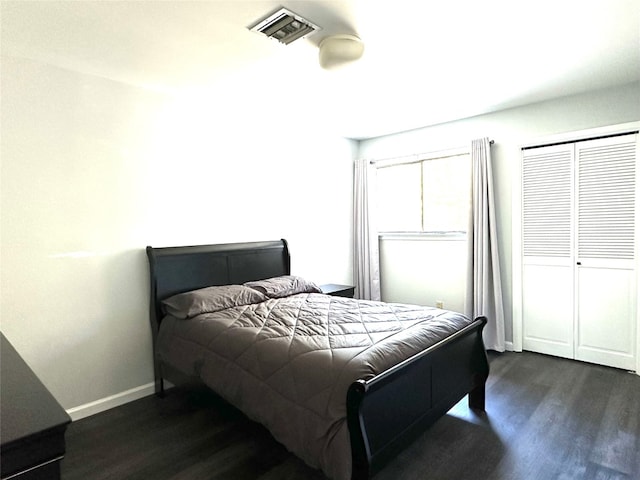 bedroom featuring dark hardwood / wood-style flooring