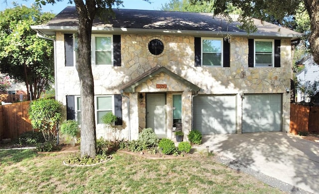 13242 Kerrville Folkway, Austin, TX 78729 - view of front of home featuring stone siding, driveway, and an attached garage