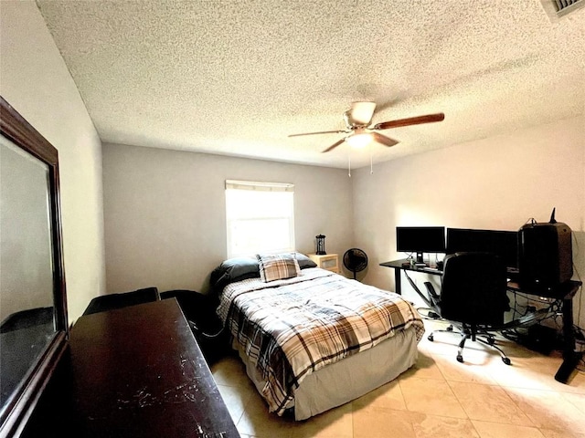13242 Kerrville Folkway, Austin, TX 78729 - bedroom with light tile patterned flooring, an office area, a textured ceiling, and ceiling fan