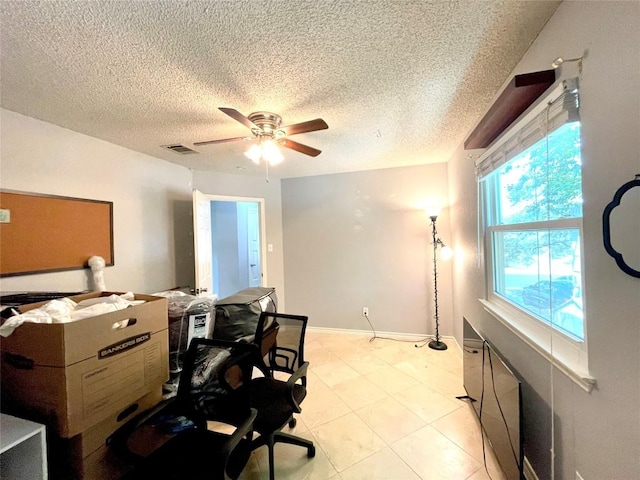13242 Kerrville Folkway, Austin, TX 78729 - home office with a ceiling fan, a textured ceiling, and baseboards