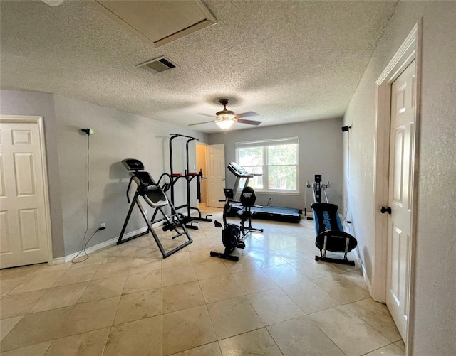 13242 Kerrville Folkway, Austin, TX 78729 - workout room with baseboards, light tile patterned floors, ceiling fan, and a textured ceiling
