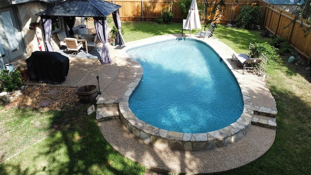 view of pool featuring area for grilling, a yard, a gazebo, and a patio