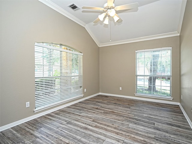 spare room with hardwood / wood-style floors, ceiling fan, ornamental molding, and vaulted ceiling