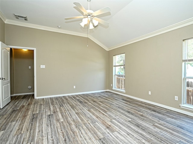 spare room featuring hardwood / wood-style flooring, vaulted ceiling, ceiling fan, and ornamental molding