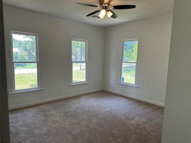 carpeted empty room featuring ceiling fan