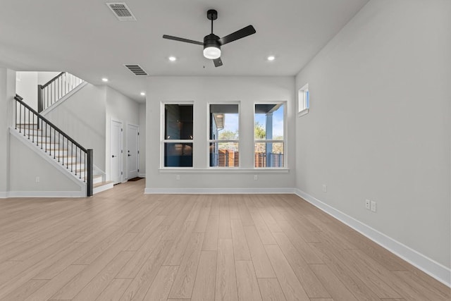 unfurnished living room featuring light hardwood / wood-style floors and ceiling fan