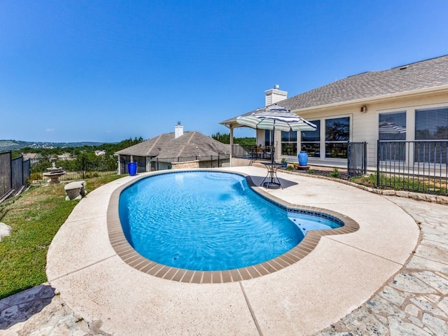 view of swimming pool featuring a patio area and a gazebo