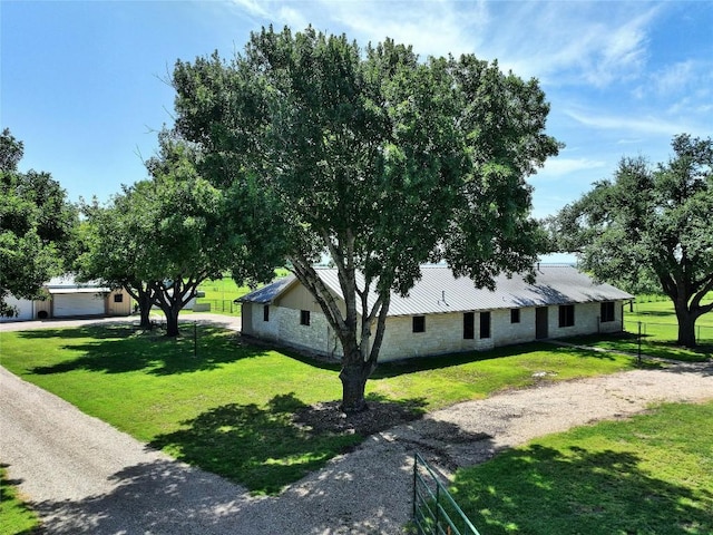 view of front facade with a garage and a front lawn