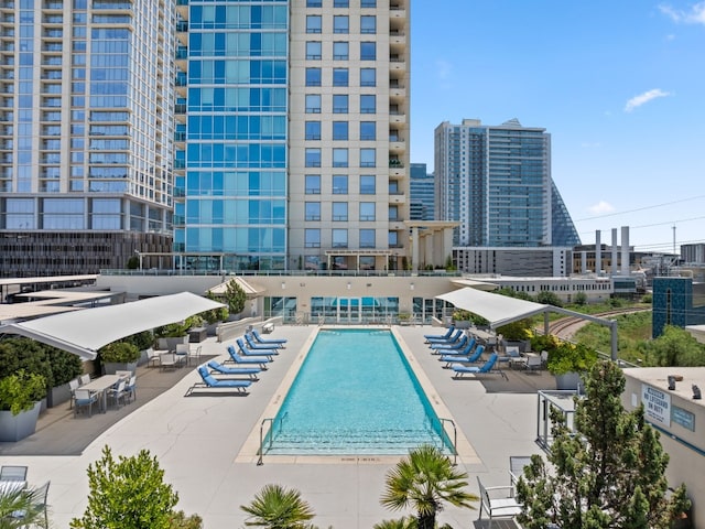 view of swimming pool featuring a patio area