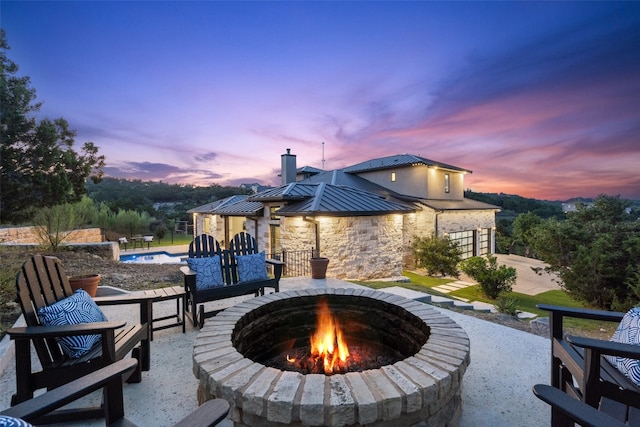 patio terrace at dusk with a fire pit