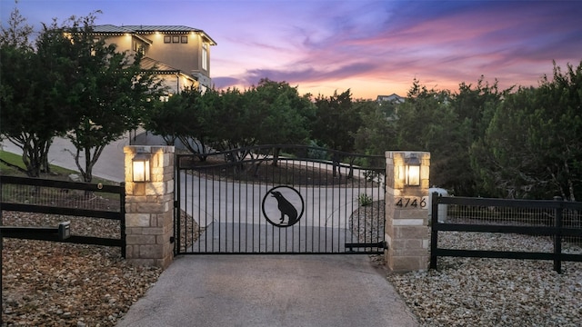 view of gate at dusk