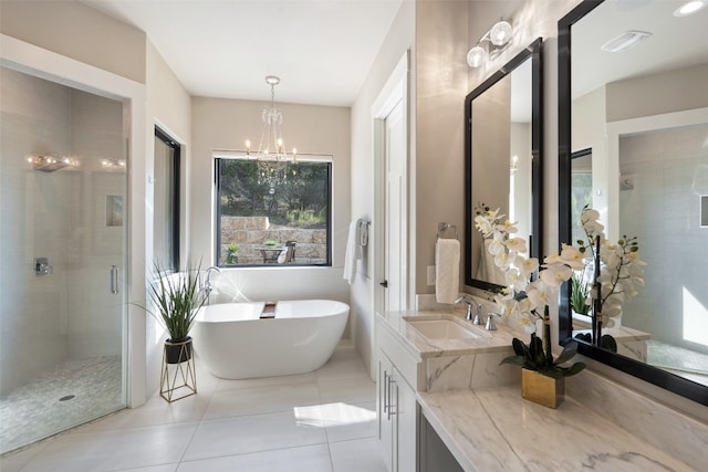 bathroom with vanity, shower with separate bathtub, a chandelier, and tile patterned floors