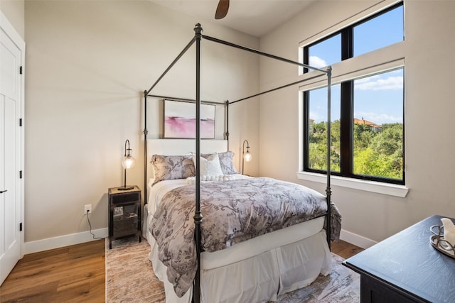 bedroom featuring wood-type flooring and ceiling fan