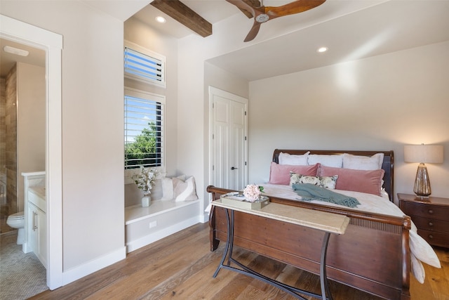 bedroom featuring ensuite bathroom, ceiling fan, and wood-type flooring