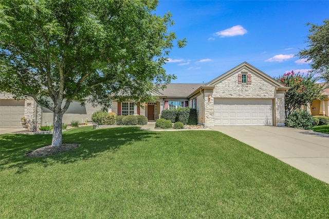 view of front of home with a garage and a front lawn