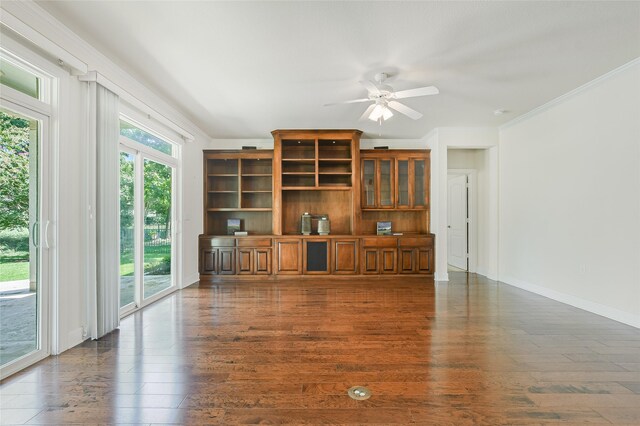 living room with crown molding, dark wood-type flooring, and ceiling fan