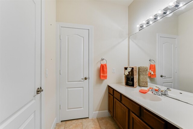 bathroom with vanity and tile patterned floors