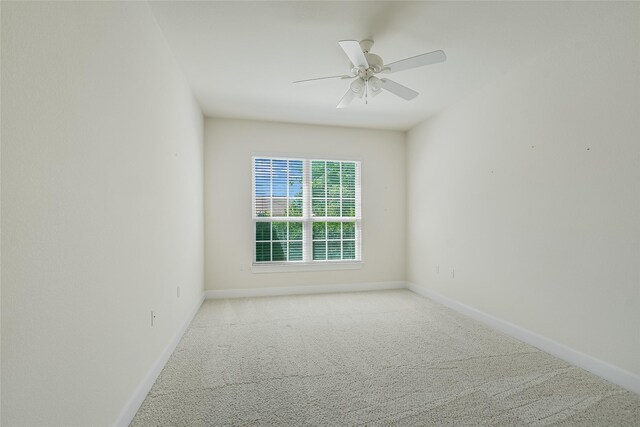 unfurnished room with carpet and ceiling fan