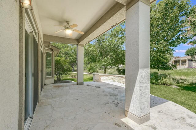 view of patio featuring ceiling fan