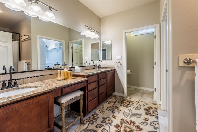 bathroom featuring tile patterned flooring and vanity