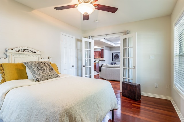 bedroom with multiple windows, dark hardwood / wood-style flooring, french doors, and ceiling fan