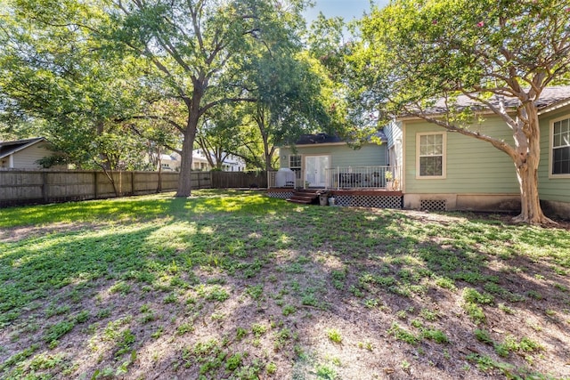 view of yard with a wooden deck