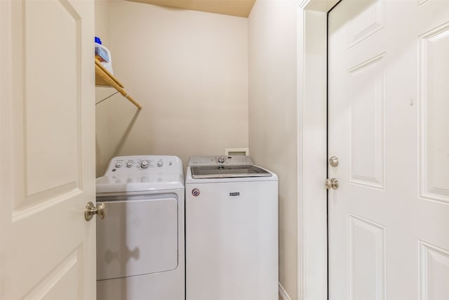 laundry area with washer and dryer