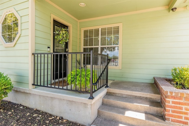 entrance to property featuring covered porch