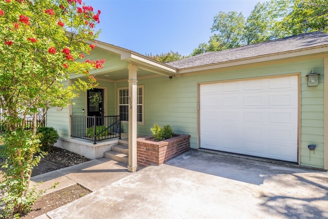 exterior space featuring a garage and covered porch