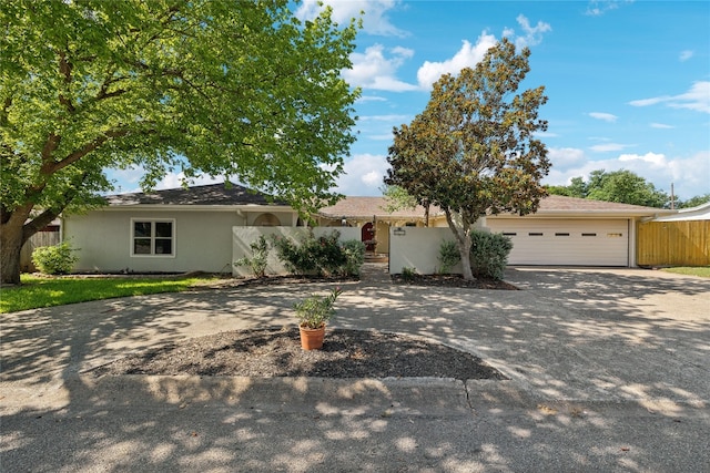 ranch-style home featuring a garage